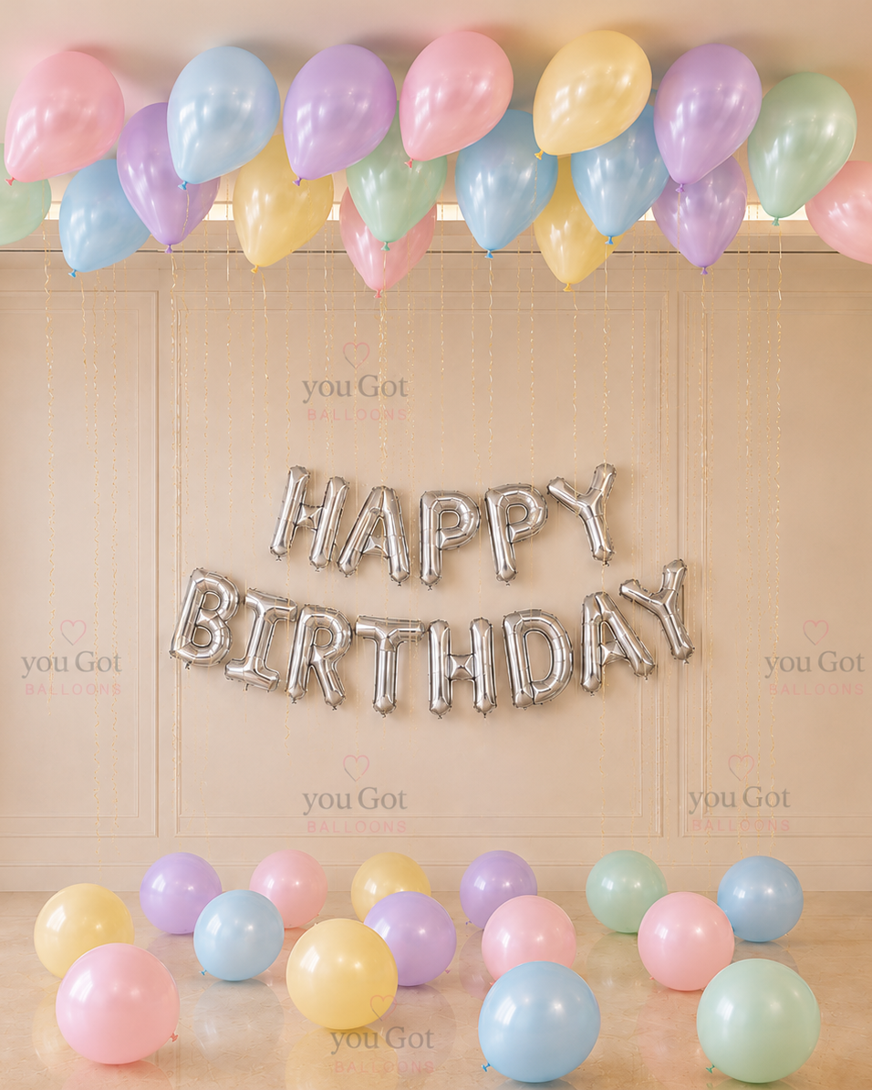 20 pastel ceiling birthday balloon setup with floor balloons and birthday banner in Dubai