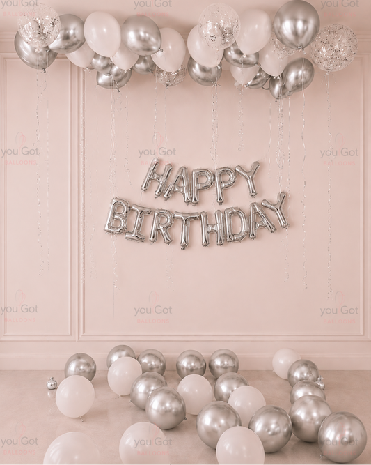 20 white and silver ceiling birthday balloon setup with silver birthday banner in Dubai