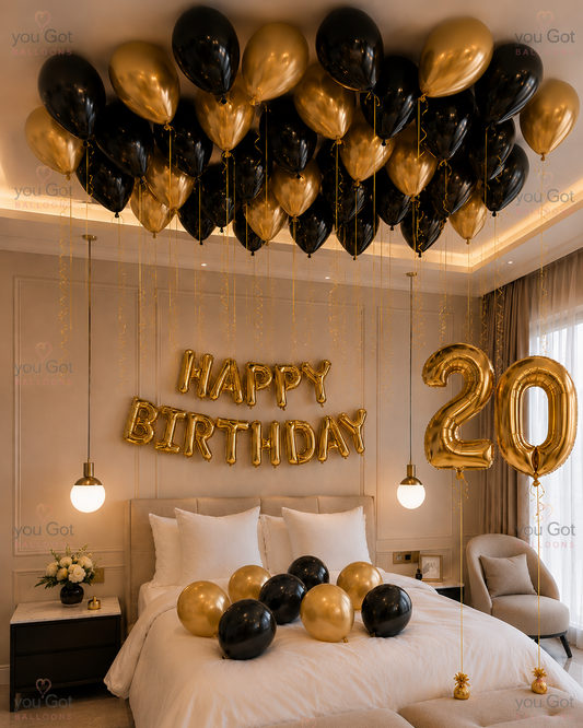 20th birthday black and gold ceiling balloon setup with number balloons in Dubai