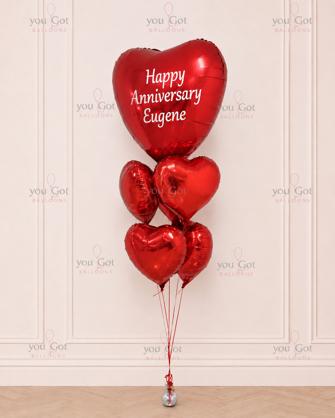 Customized giant red heart foil balloons with anniversary message in Dubai