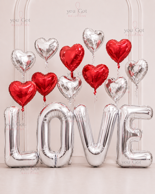 Valentines red heart foil balloon arrangement for romantic surprise in Dubai